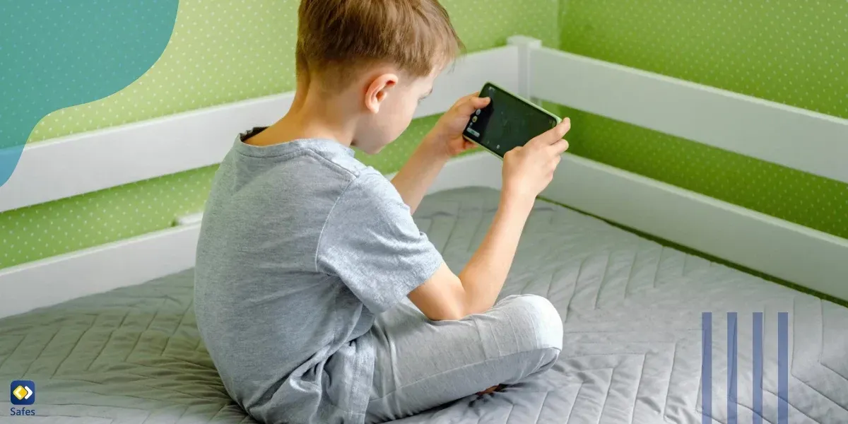 Little boy sitting on bed navigating the internet