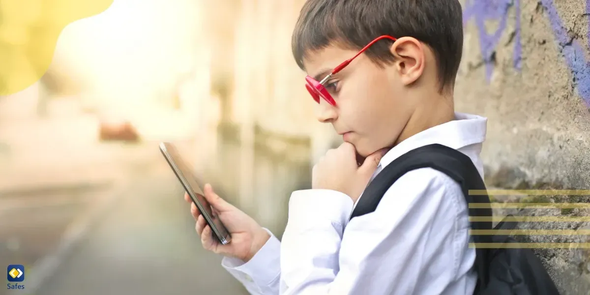 Young boy playing Pokémon Go in the street