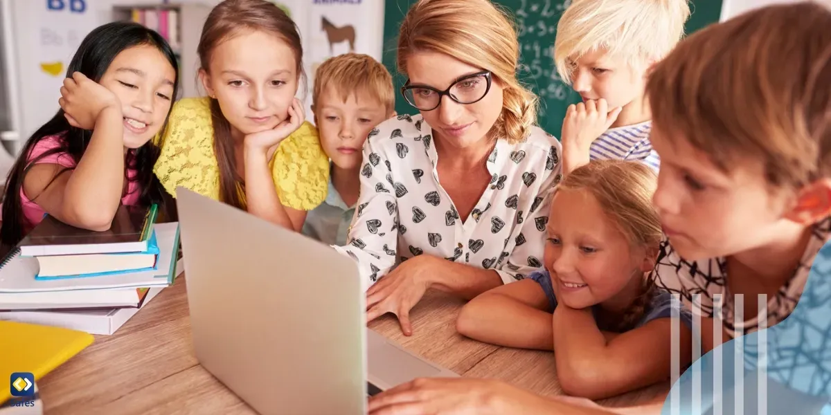 Students and teacher looking at laptop